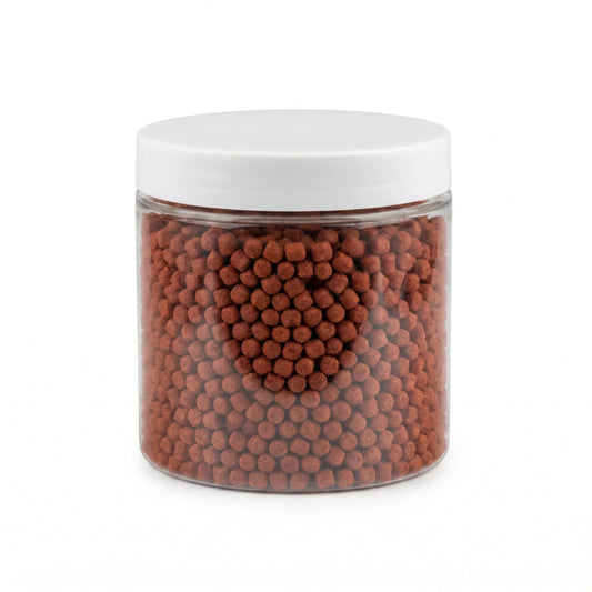 Jar of red scented fishing bait pellets
